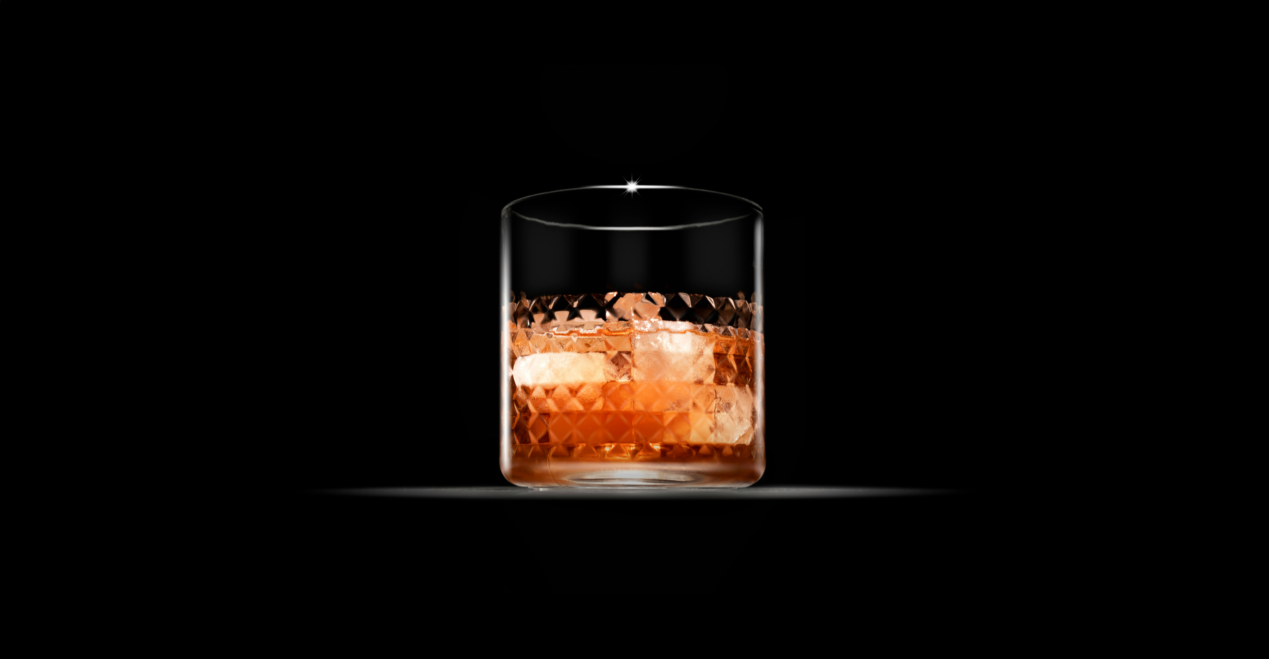 A cocktail with cardamom in a short glass